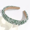 Detail of green rhinestones and white pearls on headband with khaki velvet lining - Green