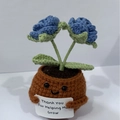 Handmade knitted blue flowers in brown pot with a positive Thank You card message - Positive Potted-Double Head Rose Blue