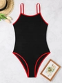 Detailed view of black backless swimsuit with red piping and wavy jacquard texture - S / Black