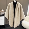 Elegant beige knitted shawl wrap with dark brown sawtooth edge stitching on a mannequin - Apricot Beige