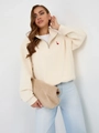 Chic cream half-zip sweatshirt with heart embroidery and high-waisted blue jeans - S / Thin Style / Apricot