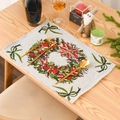Christmas place mat with festive wreath print and green bows on a wooden table - Christmas Wreath Style