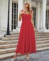 Detail of red tiered maxi dress with smocked bodice and tie straps in a summer setting - Solid Red