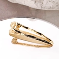 Minimalist golden metal water drop hair clip with polished finish shown on mirror - Gold