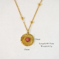 Detail showing 15mm sunburst pendant with pink stone on a 40+5cm gold chain - Wavy Sun Style (XB2401004-10)
