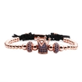 Detail of rose gold crown bead with blue zircon on black woven adjustable bracelet - Blue Zirconia Rose Gold Crown Bracelet