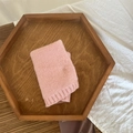 Pink warm knitted neck gaiter for kids presented on a rustic wooden tray - Solid Pink