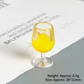 Detailed view of mini resin wine glass charm with yellow filling and hanging loop - Yellow