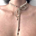 Macro detail of Y2K star necklace with white pearls and silver beaded metal chains - Pearl Bow Choker X3985