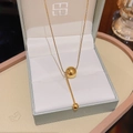 Minimalist gold titanium necklace featuring sleek ball and vertical bar pendant charms - X244 Gold Bead Minimalist