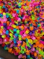Bulk set of colorful mini plastic flower hair claws in pink, orange, yellow, and blue - 3-Prong Rose Style