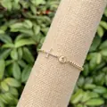 Detailed view of 18k gold plated beaded bracelet with cz cross and religious charms - Round Bead Elastic Cross Religious Icon Medal (2)