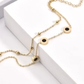 Double-layered gold titanium steel beaded bracelet with Roman numeral ring pendants - Gold