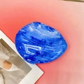 Detailed top view of blue marble acrylic clutch bag with artistic stone texture finish - Blue