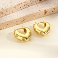Close-up of gold-plated V-shaped heart earrings with star engravings and cubic zirconia - Gold Heart
