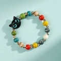 Ceramic bracelet with black big-eye cat bead and colorful porcelain beads on blue backdrop - Big Eye Black Cat Pattern Style (1598-04) / Colorful