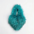 Detail of teal faux fur crossbody bag showing fluffy texture and black tipped plush hairs - Small / Lake Blue