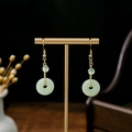 Detail of long tassel earrings with light green jade donut and gold hollowed flower - Light Green Jade Peace Buckle Ring (E1253-2)