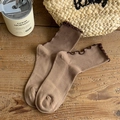 Vintage brown ribbed crew socks with lettuce trim edges laid on a wooden surface - One Size / Khaki