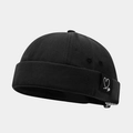 Close-up of black docker hat featuring a woven heart logo label and premium fabric texture - Adjustable / Double Heart Black