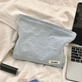 Close-up of denim bow texture and metal zipper on the light blue cosmetic storage bag - Bowknot Style / Light Blue