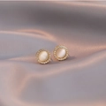Elegant gold round stud earrings with cat eye stone and zircon on grey silk background - Cat Eye Stud Earrings / Gold