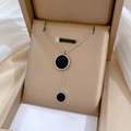 Macro detail of double black circular pendants on silver titanium steel chain - Double Black Disc Tassel Silver (N223)