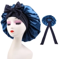 Detail view of navy blue satin sleeping cap featuring large decorative bow and long ribbons - Cross-Navy