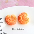 Close-up of heart shaped resin palmier miniature cookies on a plate for DIY crafts - Heart Cookie