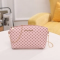 Pink crossbody bag with geometric clover print and golden chain shoulder strap - Pink