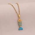 Macro detail of gold fish pendant with blue enamel scales and red gemstone eye - 4# Lake Blue