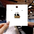 Cute panda enamel pin in a brown bears box displayed on white backing card - 147*Bear in Paper Bag Pin