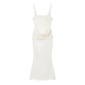 Detail of white maxi dress showing waist pleats and fishtail hem on a plain background - XS / White
