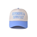 Close-up of EXPENSIVE & DIFFICULT embroidery on blue and cream cotton baseball cap - Sky Blue