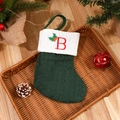 Green knit Christmas stocking with red letter B embroidery and holly leaf decoration - Letter B
