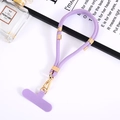 Detail of adjustable purple nylon phone lanyard with gold clips and attachment tab - Purple