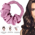 Detail showing usage steps for pink heatless silk hair roller with smooth satin texture - Pink