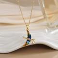 Detailed close-up of bird pendant with colorful enamel wings and crystal details on gold chain - FN0121 Gradient Enamel Swallow