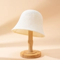 Minimalist beige crochet knit bucket hat displayed on a wooden stand for summer sun protection - M (56-58cm) / White