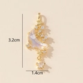 Detailed view of gold star and crescent moon pendant with embedded zircon crystals - F-Moon Star Moonstone