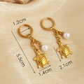 Golden turtle drop earrings with white pearls on champagne silk background, 5.5cm length - Gold