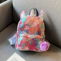 Kinder Einhorn Rucksack mit bunten Pailletten, Sternenmuster und lila Plüsch-Anhänger - Verlauf Stern Pailletten