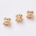 Macro detail of three gold hollow floral bead spacers for DIY jewelry making - 14K Gold Plated
