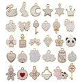 Set of 30 pink enamel gold alloy charms for DIY handmade bracelets and earrings - White Enamel Mix (HK548)