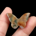 Polished natural agate butterfly figurine in yellow and green tones for decor - India Agate