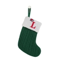 Detailed view of green knitted Christmas stocking with red embroidered letter L - Letter L