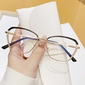Cat eye glasses in black and gold metal finish with a white leather storage pouch - Top Black Bottom Beige