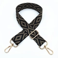 Close-up of diamond pattern woven shoulder strap with adjustable golden metal buckle - Black Base Dark Khaki
