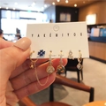 Gold plated 6-piece earring set featuring zircon symbols and lip charms on display card - E2244 Blue Zircon Character Chain