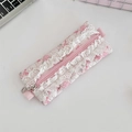 Detail of pink floral pencil case featuring white lace trim and heart metal zipper charm - Flower White Rabbit